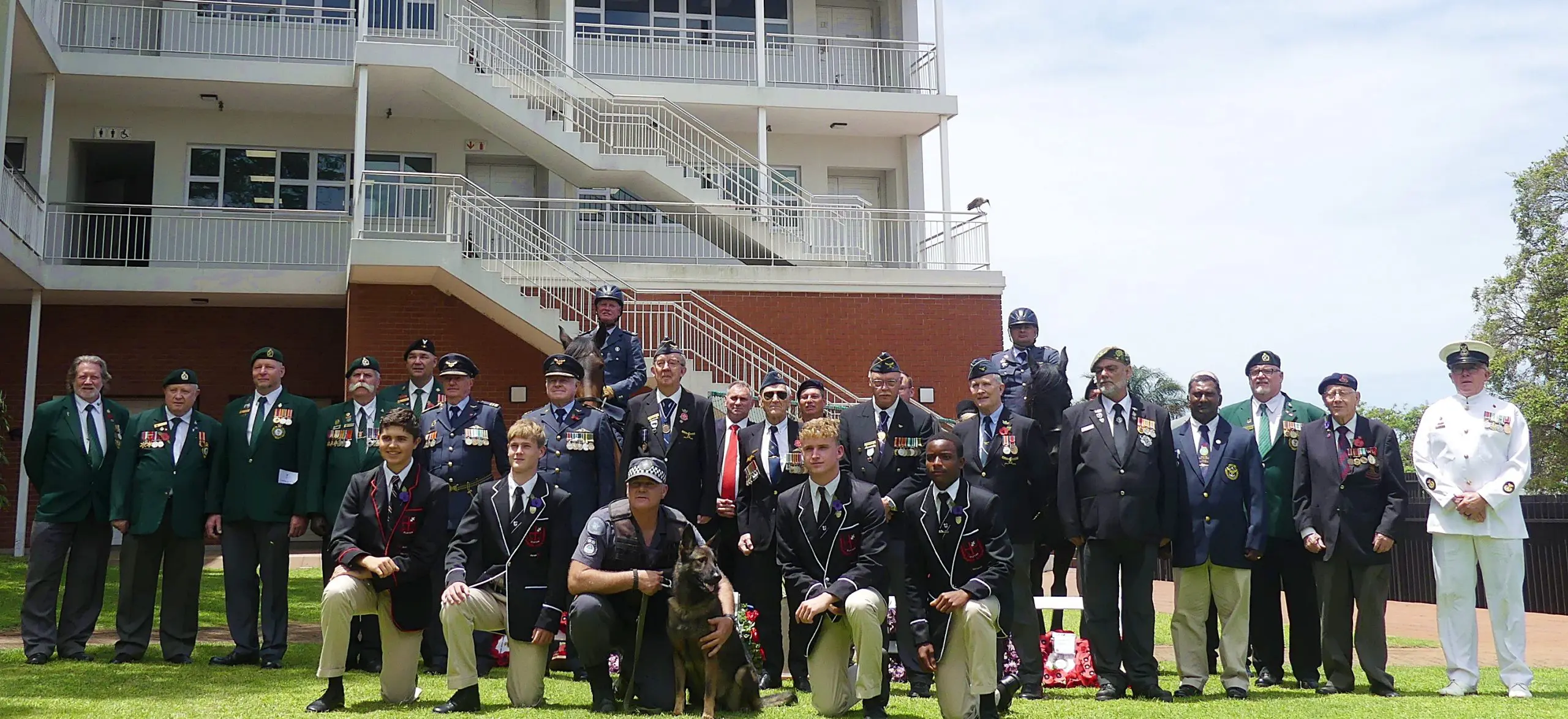 The SAPS Durban Dog Unit's Inspector Deon Carstensen is front and centre with his dog, Zena, with the representatives of various military and police units, Clifton staff and boys. 