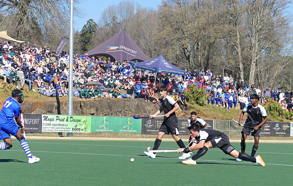 Four captains (left to right) - Luc Boyall, Keegan de Jager (with the shot), Ryde Brisset, and Tyhill Naidoo - watch De Jager's shot scream towards goal. it resulted in a penalty stroke. (Photo: Brad Morgan).