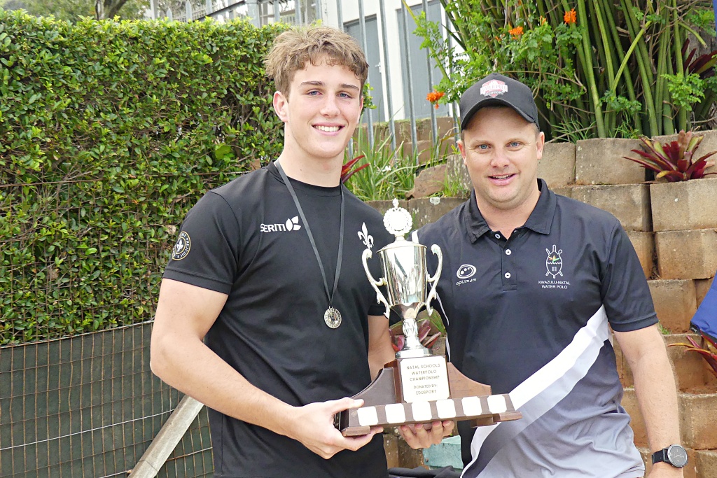 Hilton College's 1st team captain Andrew Schnell received the Overall Winners' trophy from Clifton College's Director of Water Polo, Shaun Ferreira. (Photo: Brad Morgan).